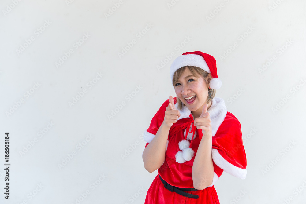 Obraz premium Beautiful young asian woman in Santa Claus clothes on white background,Thailand people,Sent happiness for children,Merry christmas,Welcome to winter,Happy woman concept
