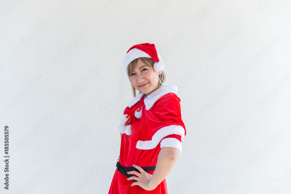 Obraz premium Beautiful young asian woman in Santa Claus clothes on white background,Thailand people,Sent happiness for children,Merry christmas,Welcome to winter,Happy woman concept
