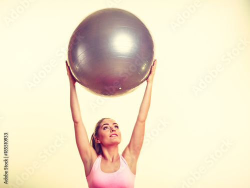 Girl exercising with fit ball