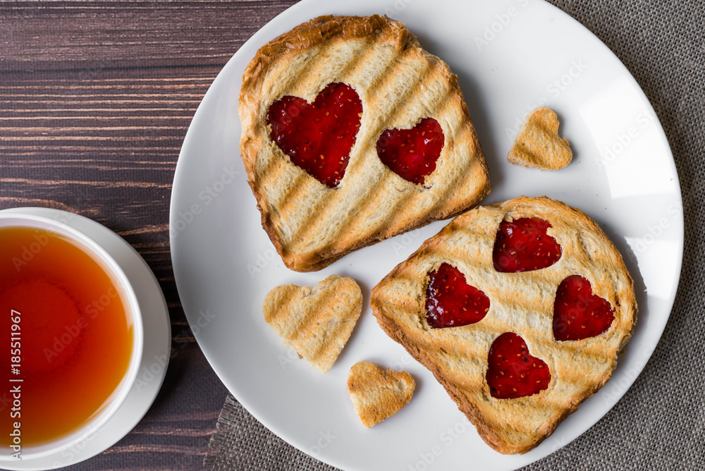 Grilled toast with raspberry jam and tea