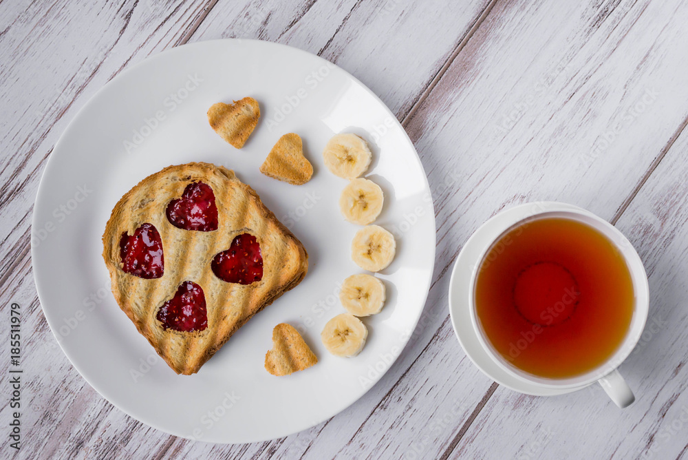 Grilled toast with raspberry jam and tea Grilled toast with raspberry jam and tea