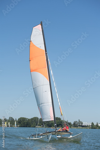 sailing on a lake - summer and sports theme