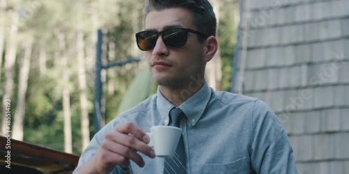 Casual Businessman Drinking Coffee. Shoto on RED Helium 8K photo