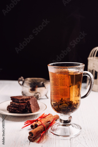hot green tea with cinnamon on white background