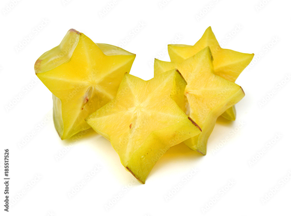 Carambola fruit with slices isolated on white background Carambola fruit with slices isolated on white background