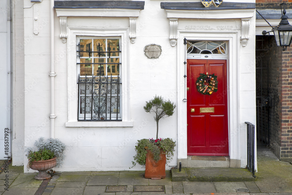 Window with red shutters, decorated with a drawing with a horse in a traditional Christmas style about south bank in London