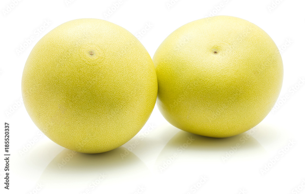 Two pamelo isolated on white background yellow pale green. Two pamelo isolated on white background yellow pale green.