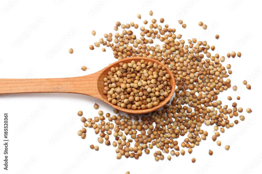 coriander seeds in wooden spoon isolated on white background top view coriander seeds in wooden spoon isolated on white background top view