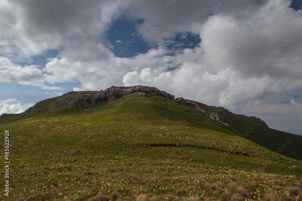Fototapeta premium The formation and movement of clouds over the summer slopes of Adygea Bolshoy Thach and the Caucasus Mountains