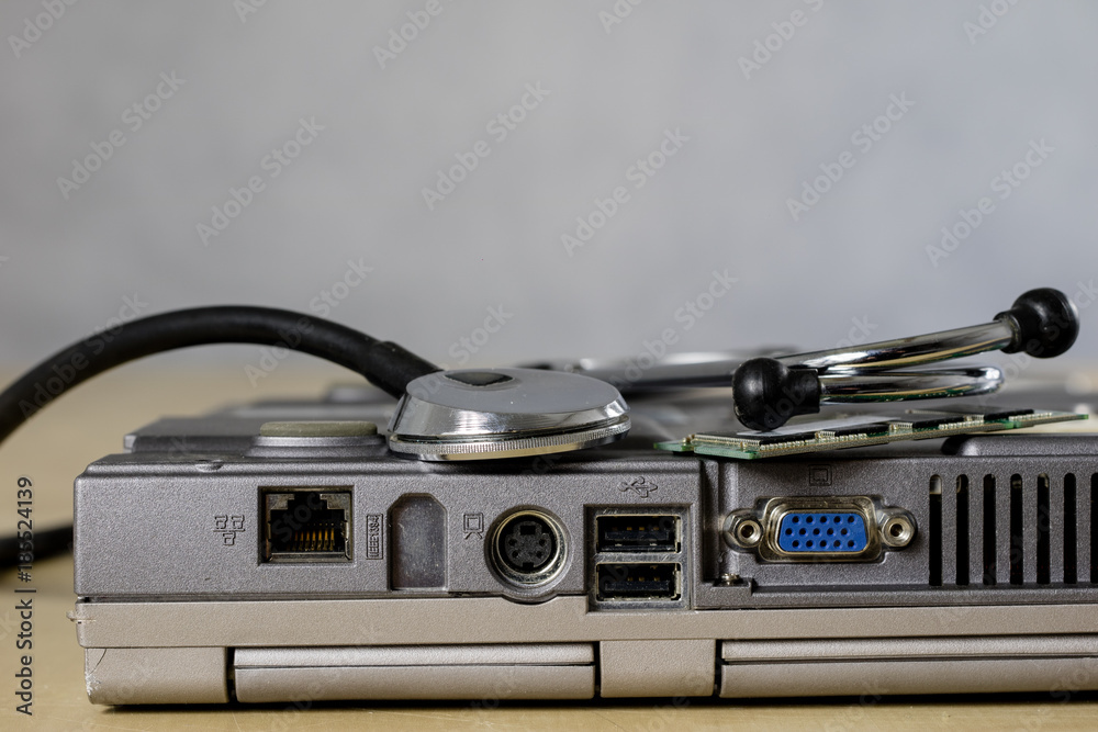 Obraz premium Computer treatment on a computer service. Repair and diagnostics of computer hardware. Computer equipment on a workshop table.