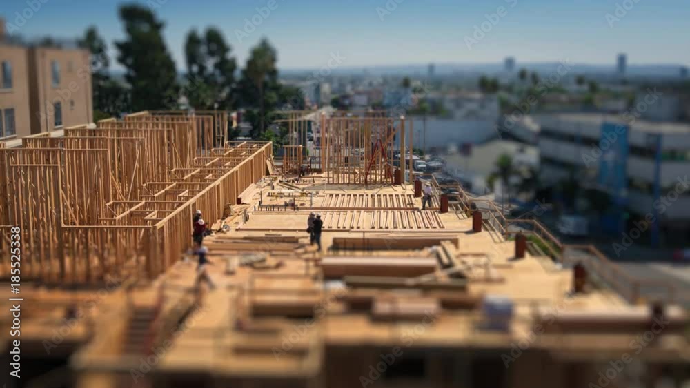 Workers building construction site Los Angeles Tilt shift city timelapse 4K