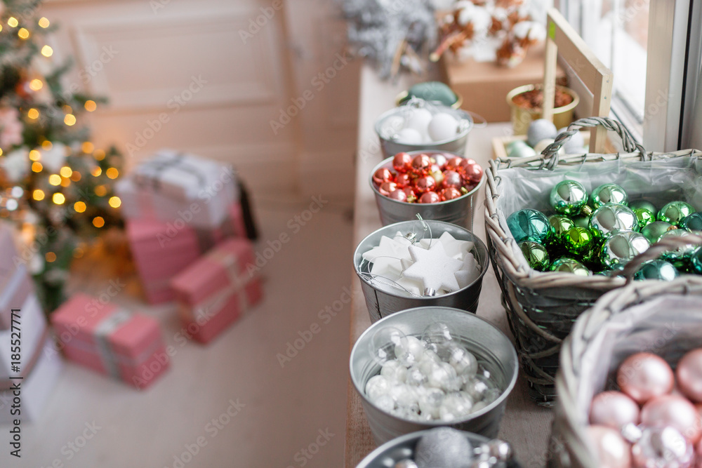Many decorations. a lot of colorful, different Christmas toys ready to decorate the house. sorted by type in baskets