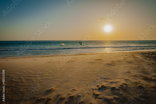Obraz na płótnie Portugal, Faro, holiday sunset on the beach w salonie