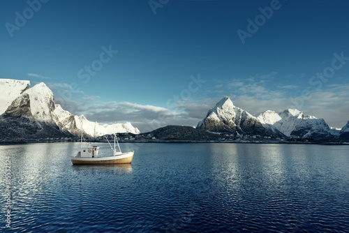 fishing boat and Reine Village  Lofoten Islands  Norway