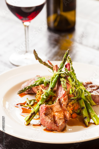 lamb lollipops with Indonesian fried rice and asparagus