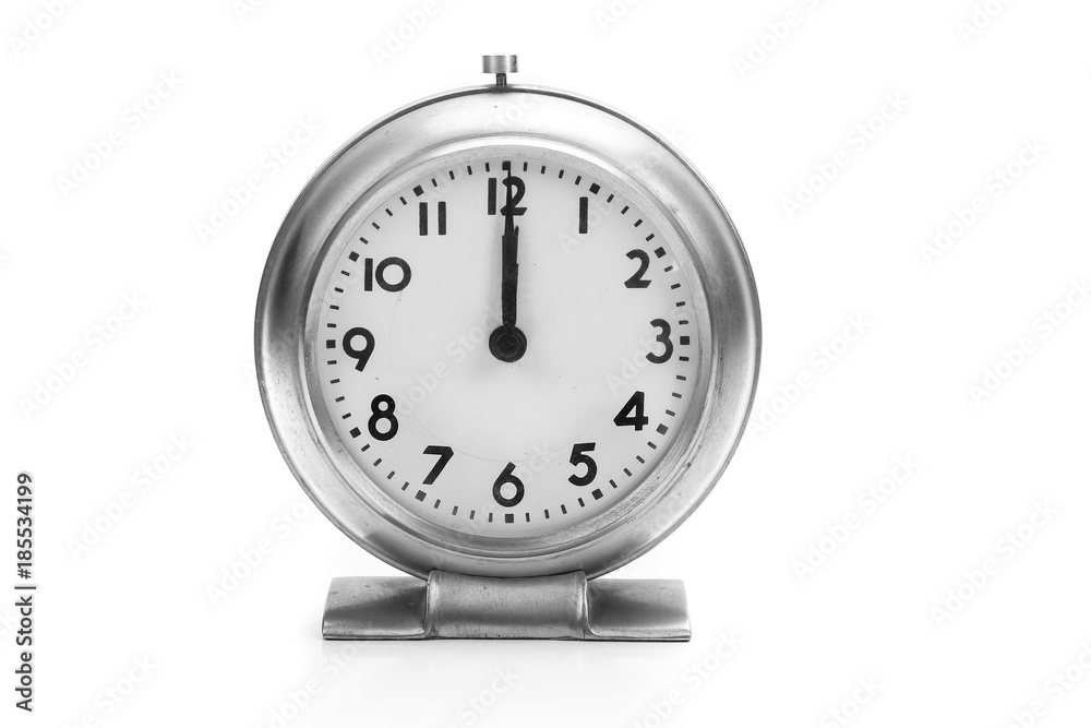 Antique Alarm clock with hands at 12:00 isolated black and white Antique Alarm clock with hands at 12:00 isolated black and white