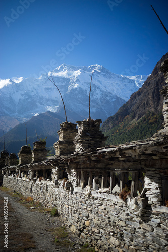 Buddhist gompa and prayer flags in the Himalaya range, Annapurna region, Nepal