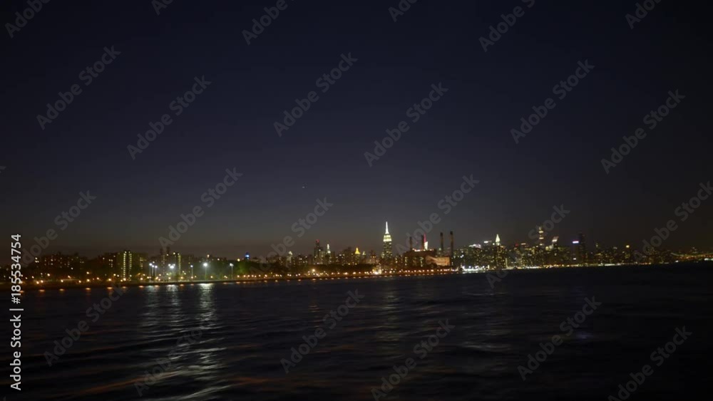 NY, USA – Moving timelapse/Hyperlapse on New York ferry at night with Manhattan skyline in view NY, USA – Moving timelapse/Hyperlapse on New York ferry at night with Manhattan skyline in view