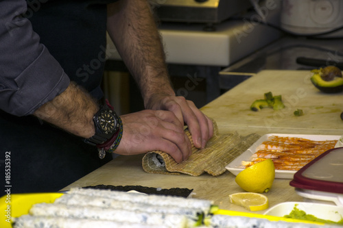 Making traditional Japanese sushi rolls