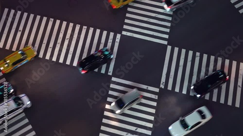 Trafffic crossing an interestion in Ginza, Tokyo at night photo