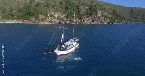 Wallpaper Mural WHITSUNDAY ISLANDS – FEBRUARY 2016 : Aerial shot of sailboat on a beautiful day with divers and amazing landscape in view Torontodigital.ca