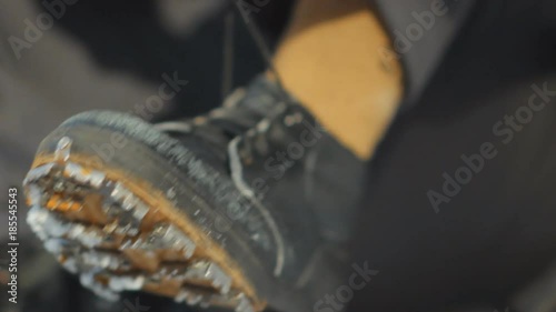 The climber wears shoes