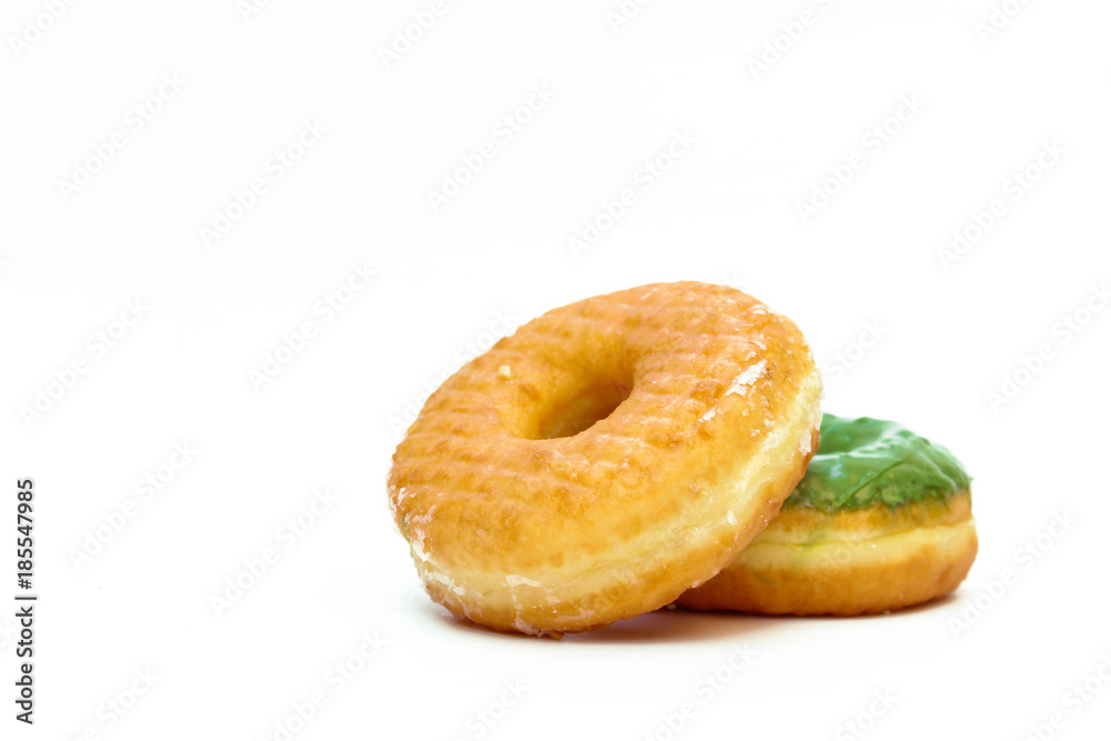 Brown and green glazed donut isolated on white background Brown and green glazed donut isolated on white background