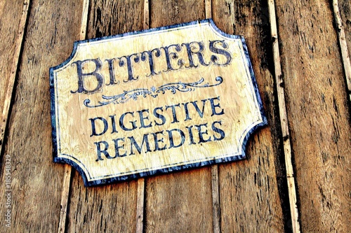 Vintage style sign on a wooden background.
