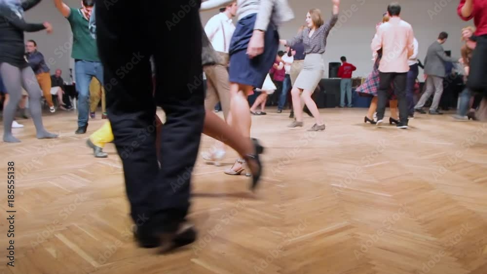 Dancers perform lindy hop dance at the swing festival. Dancing legs close up. Dancers perform lindy hop dance at the swing festival. Dancing legs close up.