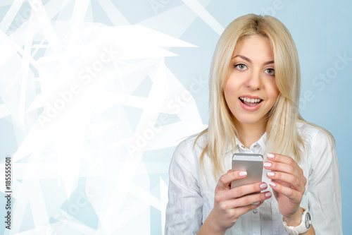 Casual young woman using mobile phone