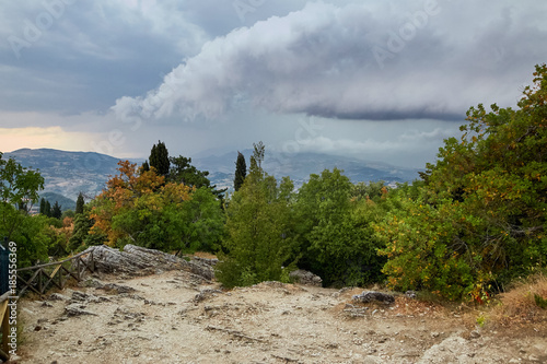 Gloomy sky with clouds over the mountains of Italy.