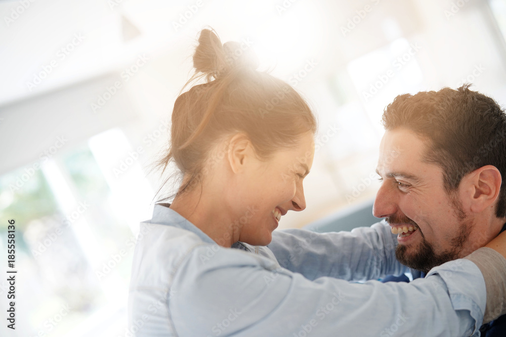 Cheerful romantic couple of lovers cuddling Cheerful romantic couple of lovers cuddling