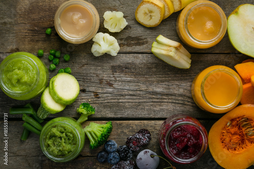 Colorful baby food purees in glass jars