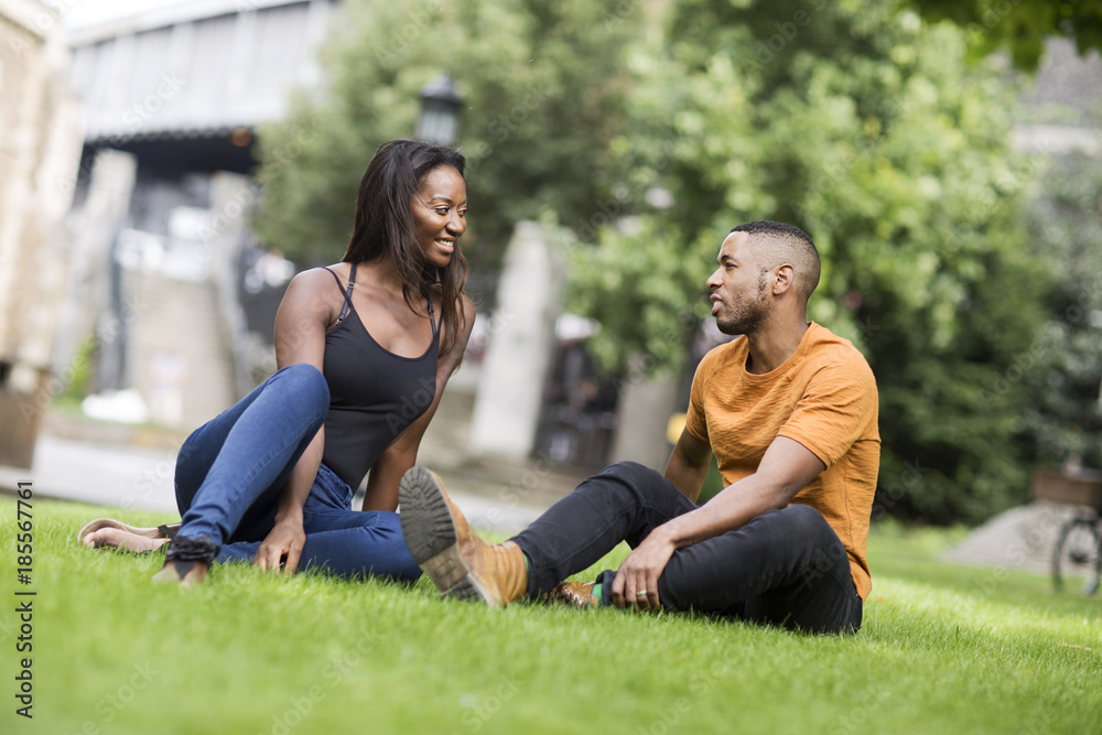 young couple sitting in the park young couple sitting in the park