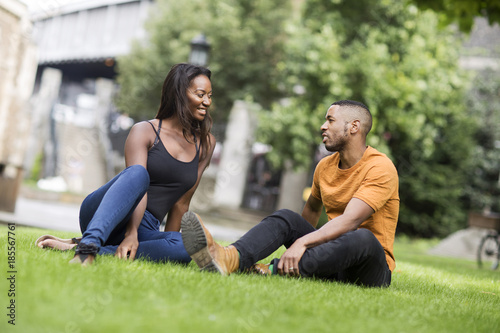 young couple sitting in the park