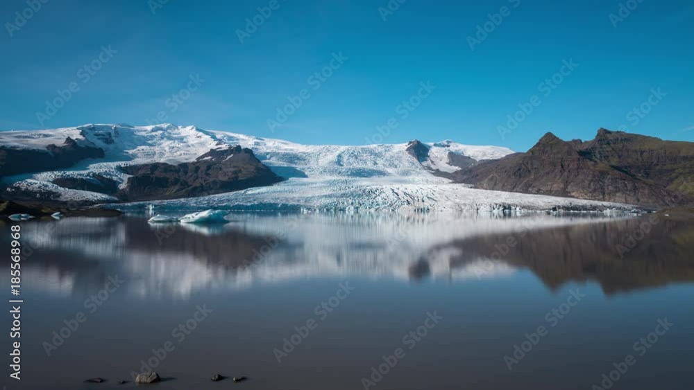 ICELAND – 2016 : Timelapse of Fjallsárlón glacier lagoon on a sunny day with shadows moving in view ICELAND – 2016 : Timelapse of Fjallsárlón glacier lagoon on a sunny day with shadows moving in view