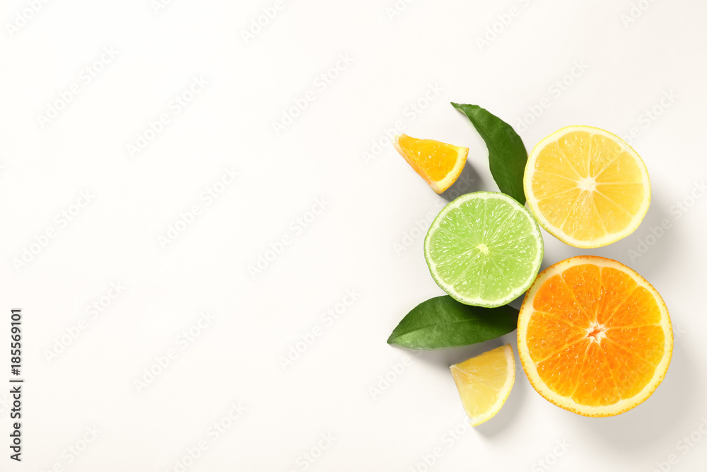 Composition with ripe lemon, orange and lime on white background Composition with ripe lemon, orange and lime on white background