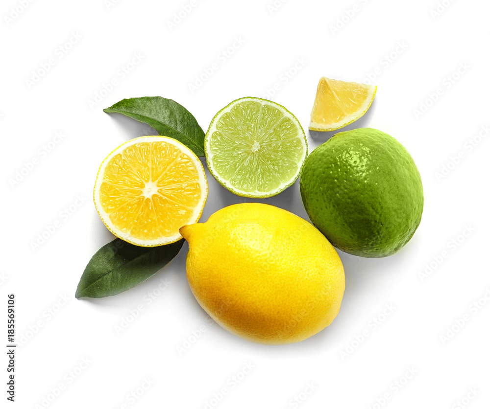 Composition with ripe lemons and limes on white background