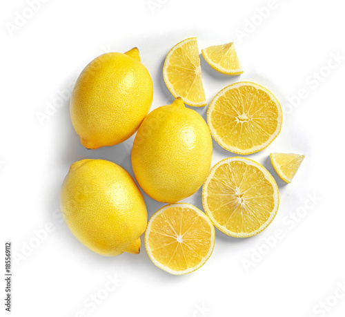 Composition with ripe lemons on white background