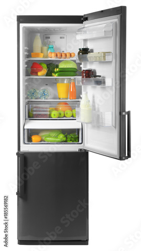Refrigerator with fresh products on white background