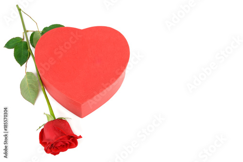 Gift box in the form of heart and scarlet rose isolated on white background.