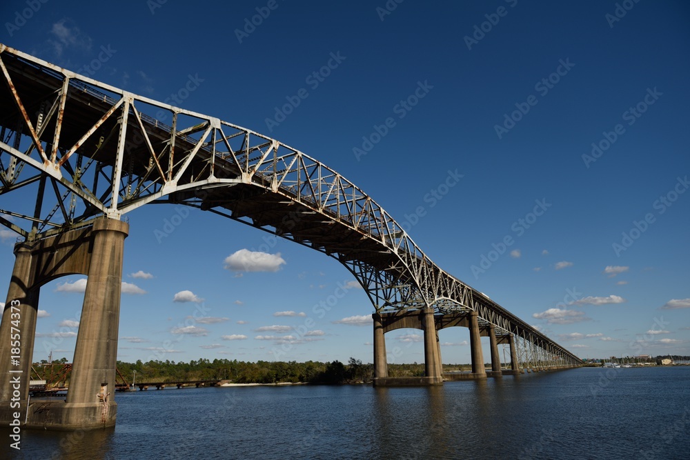Low angle view of the Calcasieu River Bridge against blue skies and clouds, Lake Charles, Louisiana