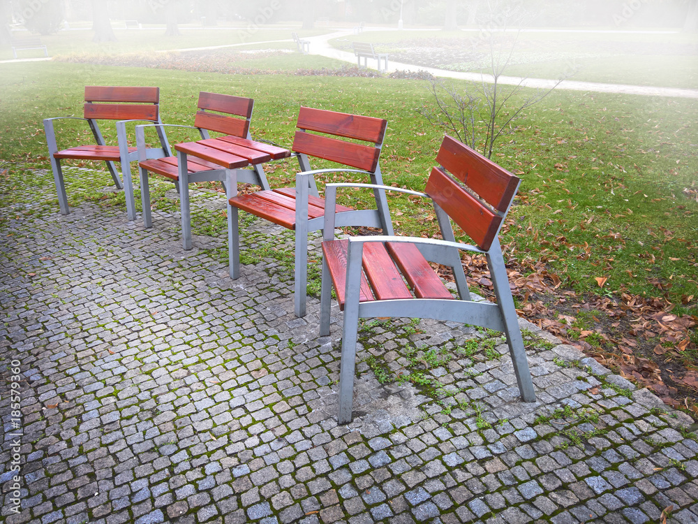 Empty park banches and seats in November Empty park banches and seats in November