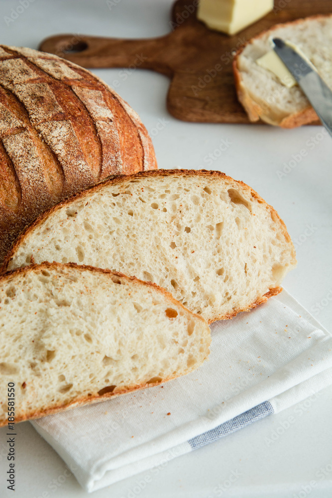Homemade fresh bread sliced on a white background. Homemade fresh bread sliced on a white background.