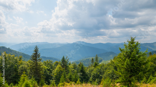 View on Carpathians mountains valley in cloudy summer day
