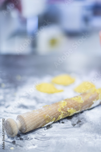 Preparing sweets , working out the dough and baking pastry in the bakery photo