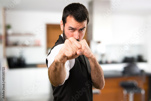 Cool man fighting inside house