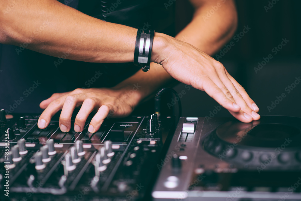 DJ's hands control the remote control close-up DJ's hands control the remote control close-up