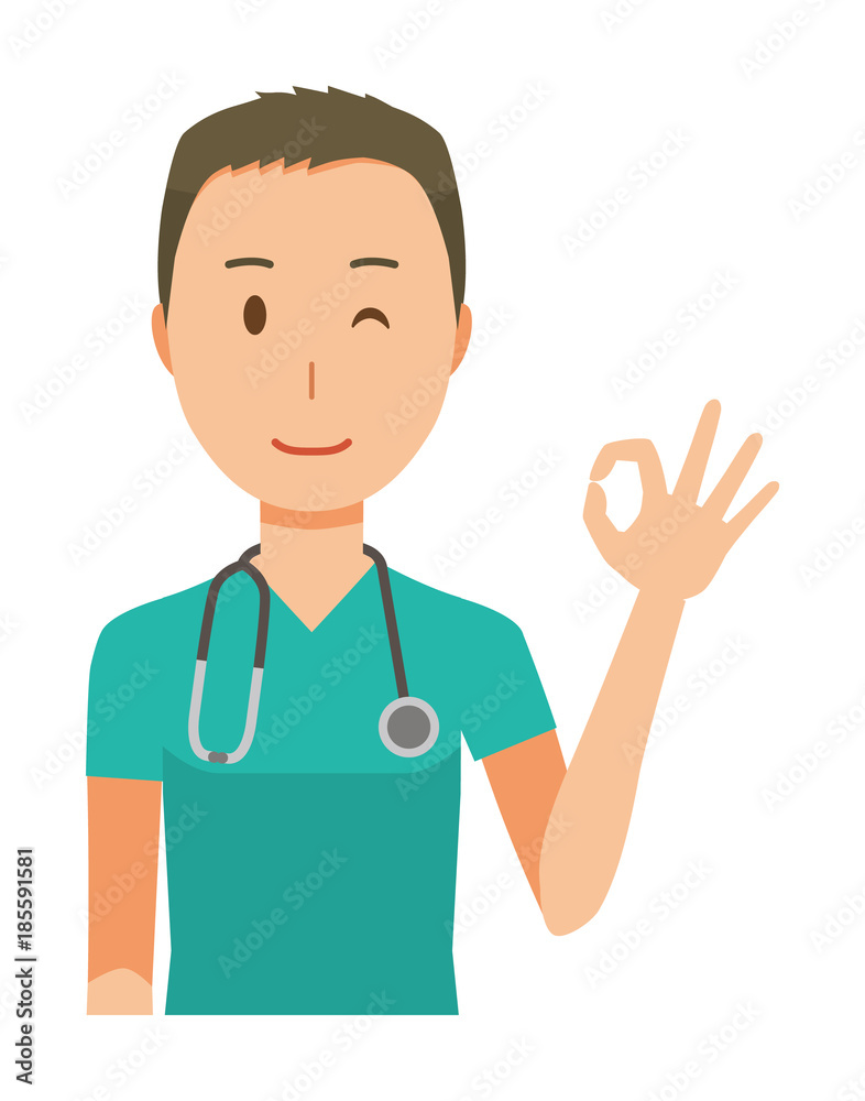 A male doctor wearing a green scrub is doing an okay sign