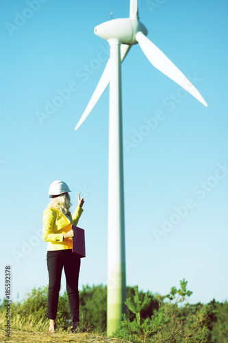 Woman engineer with wind turbine 